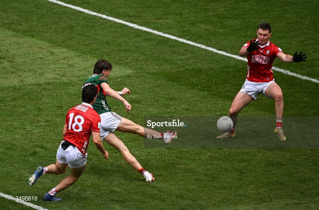 27 June 2026; Kobe McDonald of Mayo has a shot on goal under pressure from Seán Brady, left, and Maurice Shanley of Cork during the GAA Football All-Ireland Senior Championship quarter-final match between Cork and Mayo at Croke Park in Dublin. Photo by Sam Barnes/Sportsfile