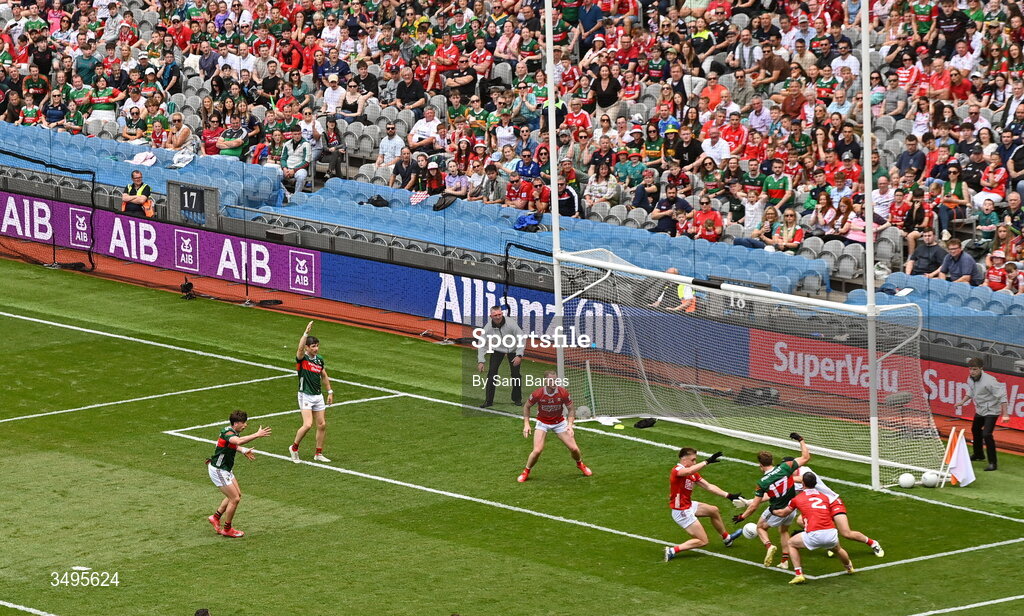 27 June 2026; Diarmuid Duffy of Mayo has a shot on goal under pressure from Cork players, from left, Tommy Walsh, Patrick Doyle and Maurice Shanley during the GAA Football All-Ireland Senior Championship quarter-final match between Cork and Mayo at Croke Park in Dublin. Photo by Sam Barnes/Sportsfile