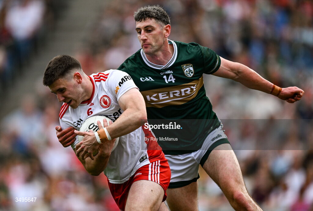 27 June 2026; Niall Devlin of Tyrone is tackled by Paul Geaney of Kerry during the GAA Football All-Ireland Senior Championship quarter-final match between Kerry and Tyrone at Croke Park in Dublin. Photo by Ray McManus/Sportsfile