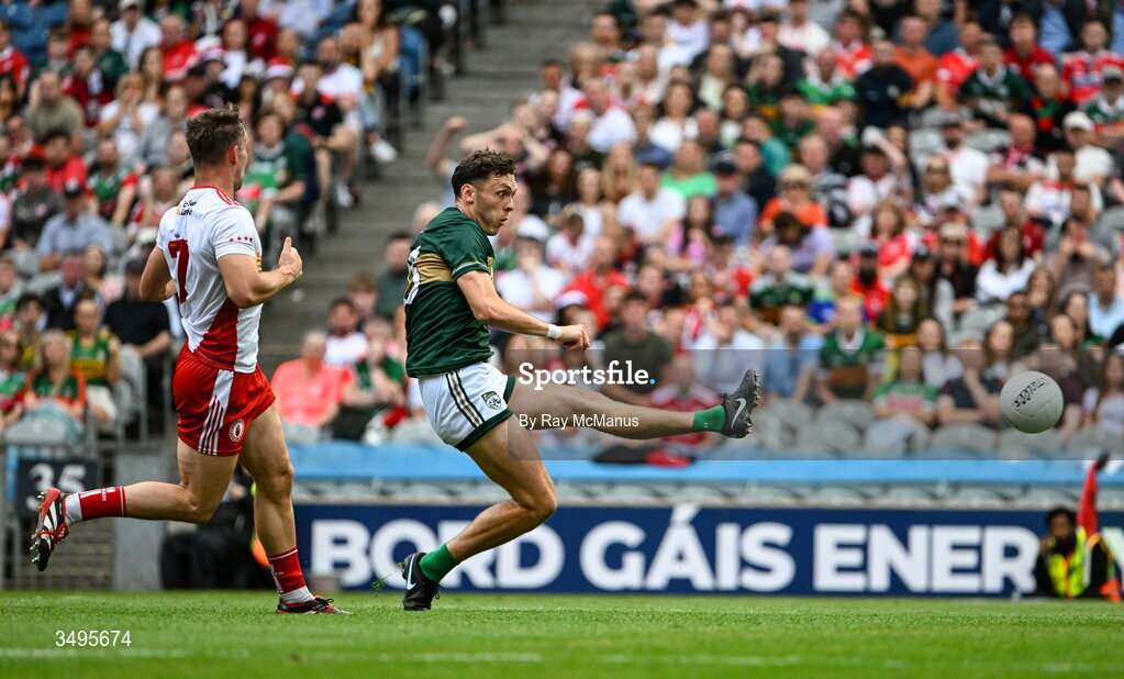 27 June 2026; David Clifford of Kerry scores a goal, in the 20th minute, despite the attention of Kieran McGeary of Tyrone  the GAA Football All-Ireland Senior Championship quarter-final match between Kerry and Tyrone at Croke Park in Dublin. Photo by Ray McManus/Sportsfile