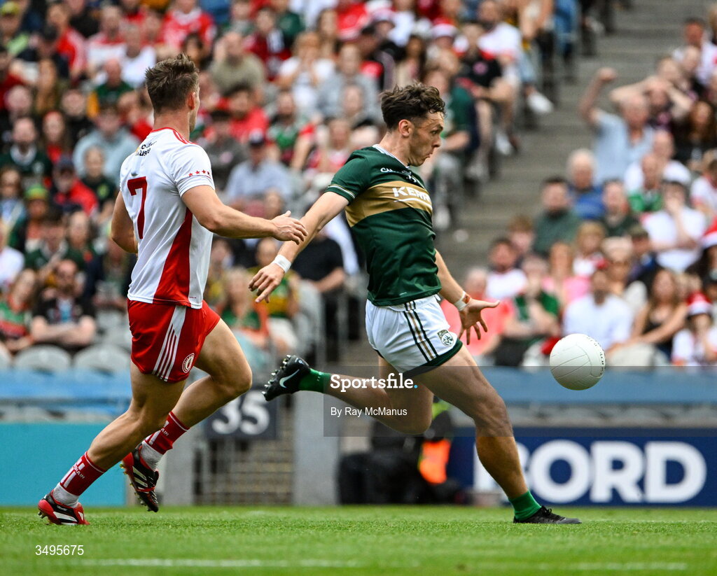 27 June 2026; David Clifford of Kerry scores a goal, in the 20th minute, despite the attention of Kieran McGeary of Tyrone  the GAA Football All-Ireland Senior Championship quarter-final match between Kerry and Tyrone at Croke Park in Dublin. Photo by Ray McManus/Sportsfile