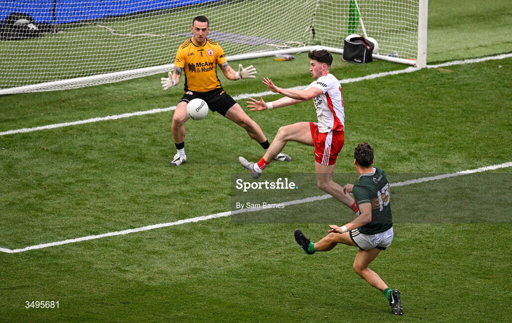 27 June 2026; David Clifford of Kerry scores his side's first goal despite the efforts of Tyrone goalkeeper Niall Morgan and Ciaran Daly of Tyrone during the GAA Football All-Ireland Senior Championship quarter-final match between Kerry and Tyrone at Croke Park in Dublin. Photo by Sam Barnes/Sportsfile