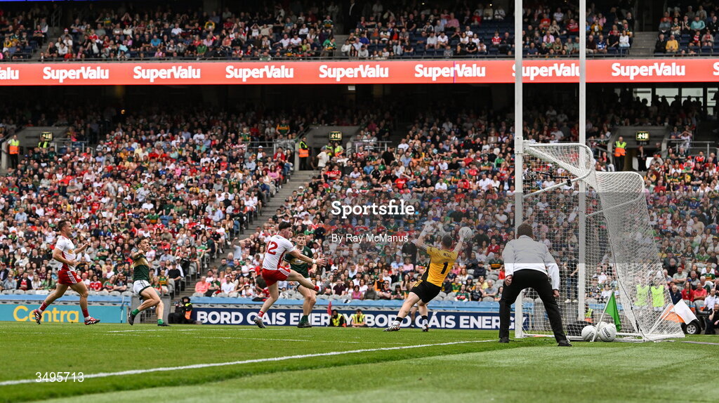 27 June 2026; David Clifford of Kerry shoots past Tyrone goalkeeper Niall Morgan to score a goal, in the 20th minute, during the GAA Football All-Ireland Senior Championship quarter-final match between Kerry and Tyrone at Croke Park in Dublin. Photo by Ray McManus/Sportsfile