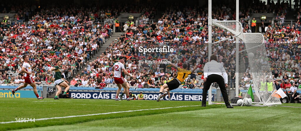 27 June 2026; David Clifford of Kerry shoots past Tyrone goalkeeper Niall Morgan to score a goal, in the 20th minute, during the GAA Football All-Ireland Senior Championship quarter-final match between Kerry and Tyrone at Croke Park in Dublin. Photo by Ray McManus/Sportsfile