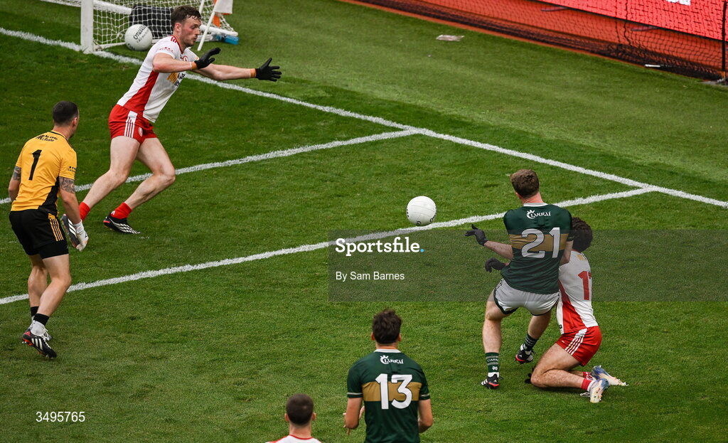 27 June 2026; Armin Heinrich of Kerry scores his side's second goal despite the efforts of Michael Rafferty of Tyrone during the GAA Football All-Ireland Senior Championship quarter-final match between Kerry and Tyrone at Croke Park in Dublin. Photo by Sam Barnes/Sportsfile