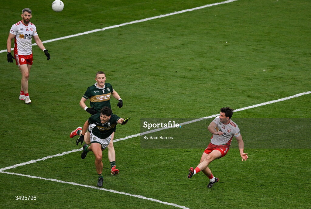 27 June 2026; Darren McCurry of Tyrone scores a point despite the efforts of Mike Breen and Jason Foley of Kerry during the GAA Football All-Ireland Senior Championship quarter-final match between Kerry and Tyrone at Croke Park in Dublin. Photo by Sam Barnes/Sportsfile