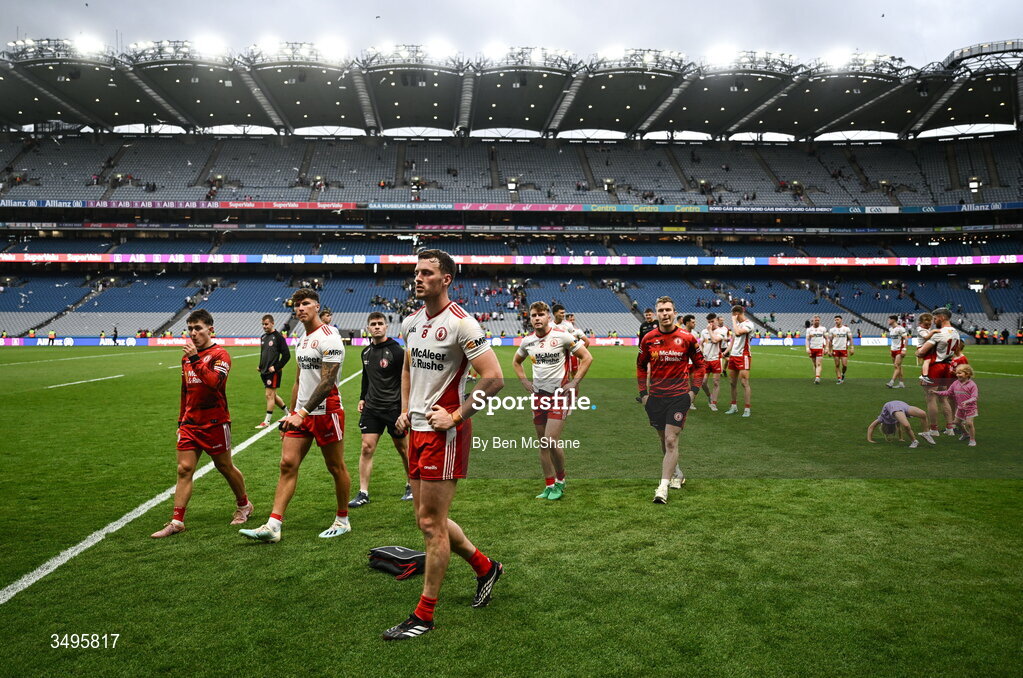 27 June 2026; Tyrone players, including Brian Kennedy, centre, make thier way off the pitch after their defeat in the GAA Football All-Ireland Senior Championship quarter-final match between Kerry and Tyrone at Croke Park in Dublin. Photo by Ben McShane/Sportsfile
