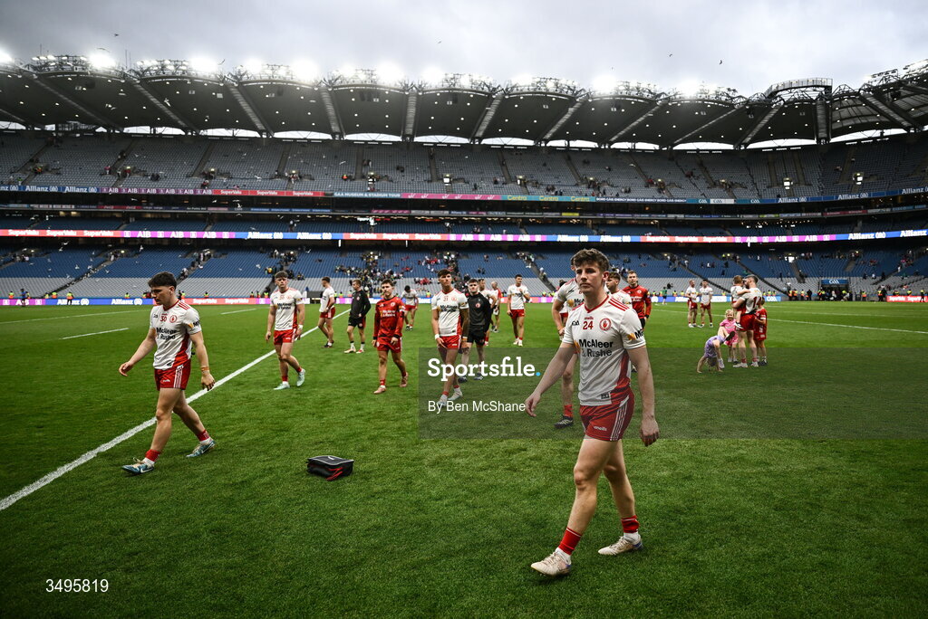 27 June 2026; Tyrone players, including Ciaran Bogue, right, make thier way off the pitch after their defeat in the GAA Football All-Ireland Senior Championship quarter-final match between Kerry and Tyrone at Croke Park in Dublin. Photo by Ben McShane/Sportsfile