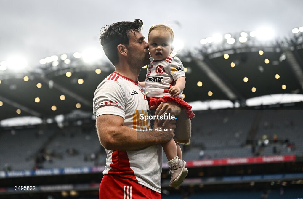 27 June 2026; Darren McCurry of Tyrone with his daughter Renn after the GAA Football All-Ireland Senior Championship quarter-final match between Kerry and Tyrone at Croke Park in Dublin. Photo by Ben McShane/Sportsfile