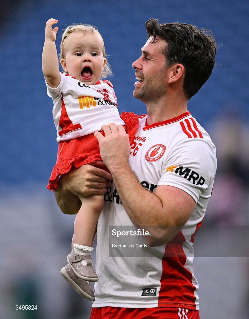 27 June 2026; Darren McCurry of Tyrone, with his daughter Renn, after the GAA Football All-Ireland Senior Championship quarter-final match between Kerry and Tyrone at Croke Park in Dublin. Photo by Ramsey Cardy/Sportsfile