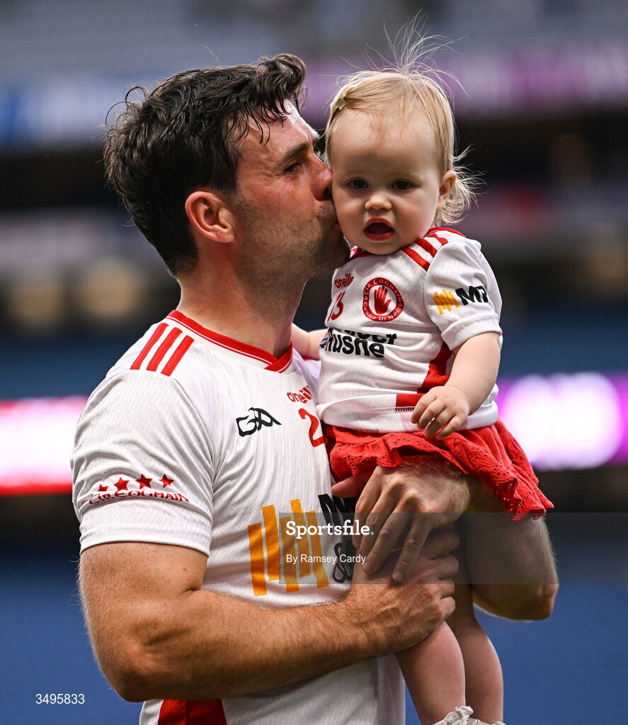 27 June 2026; Darren McCurry of Tyrone, with his daughter Renn, after the GAA Football All-Ireland Senior Championship quarter-final match between Kerry and Tyrone at Croke Park in Dublin. Photo by Ramsey Cardy/Sportsfile