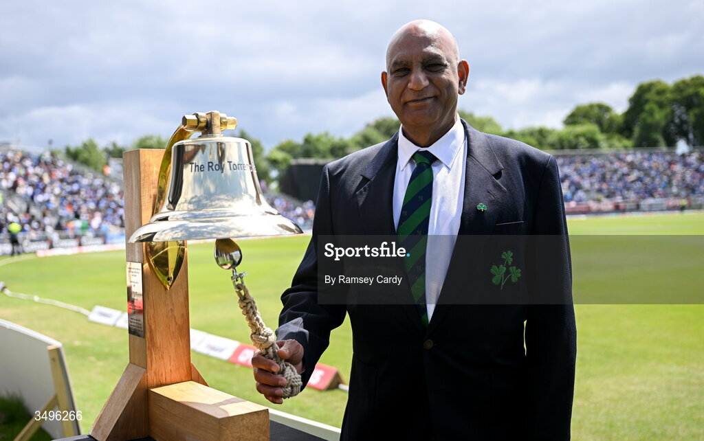 28 June 2026; Former Ireland and India international Bobby Rao rings The Roy Torrens Bell before match two of the Spinny Cup Men's T20 International series between Ireland and India at Stormont in Belfast. Photo by Ramsey Cardy/Sportsfile