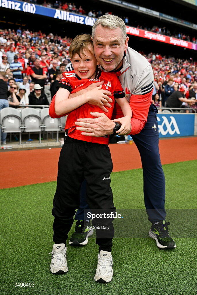 28 June 2026; Louth manager Gavin Devlin celebrates with his son Niall, age 7, after his side's victory in the GAA Football All-Ireland Senior Championship quarter-final match between Louth and Monaghan at Croke Park in Dublin. Photo by Seb Daly/Sportsfile