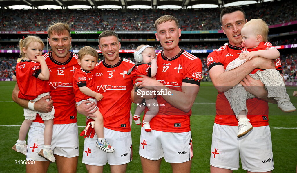 28 June 2026; Louth players, from left, Conor Grimes, Conal McKeever, Ciaran Byrne, and Tommy Durnin, celebrate with their young children after their side's victory in the GAA Football All-Ireland Senior Championship quarter-final match between Louth and Monaghan at Croke Park in Dublin. Photo by Sam Barnes/Sportsfile