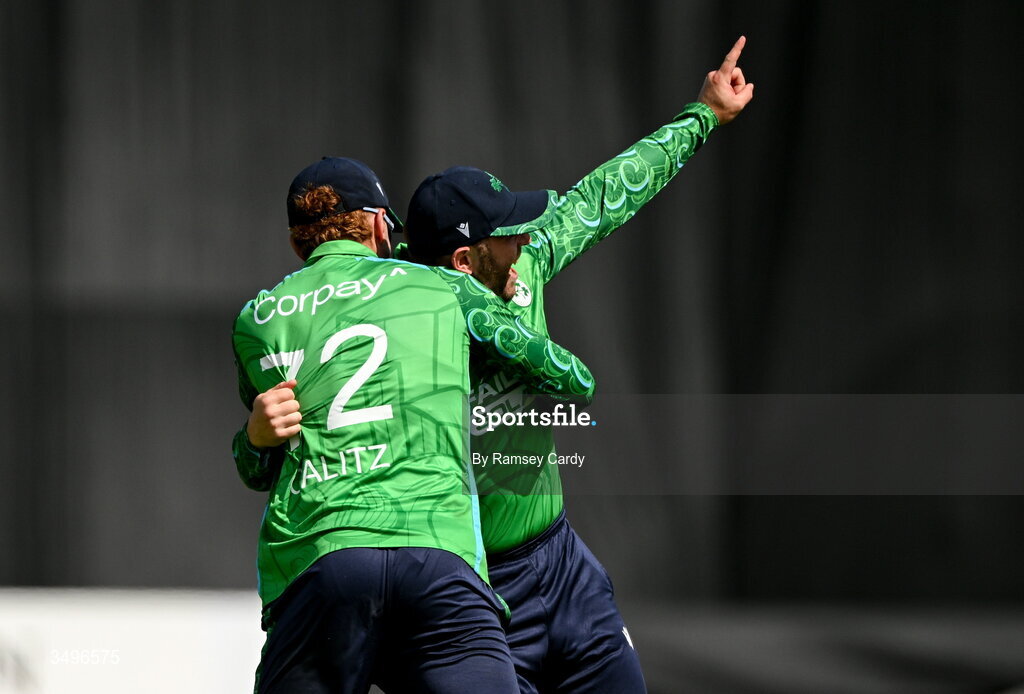 28 June 2026; Ross Adair, right, celebrates with Ireland teammate Ben Calitz after taking the wicket of Ishan Kishan of India during match two of the Spinny Cup Men's T20 International series between Ireland and India at Stormont in Belfast.  Photo by Ramsey Cardy/Sportsfile
