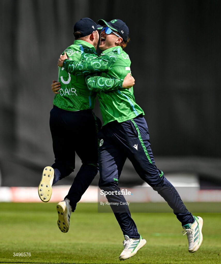 28 June 2026; Ross Adair, left, celebrates with Ireland teammate Ben Calitz after taking the wicket of Ishan Kishan of India during match two of the Spinny Cup Men's T20 International series between Ireland and India at Stormont in Belfast.  Photo by Ramsey Cardy/Sportsfile