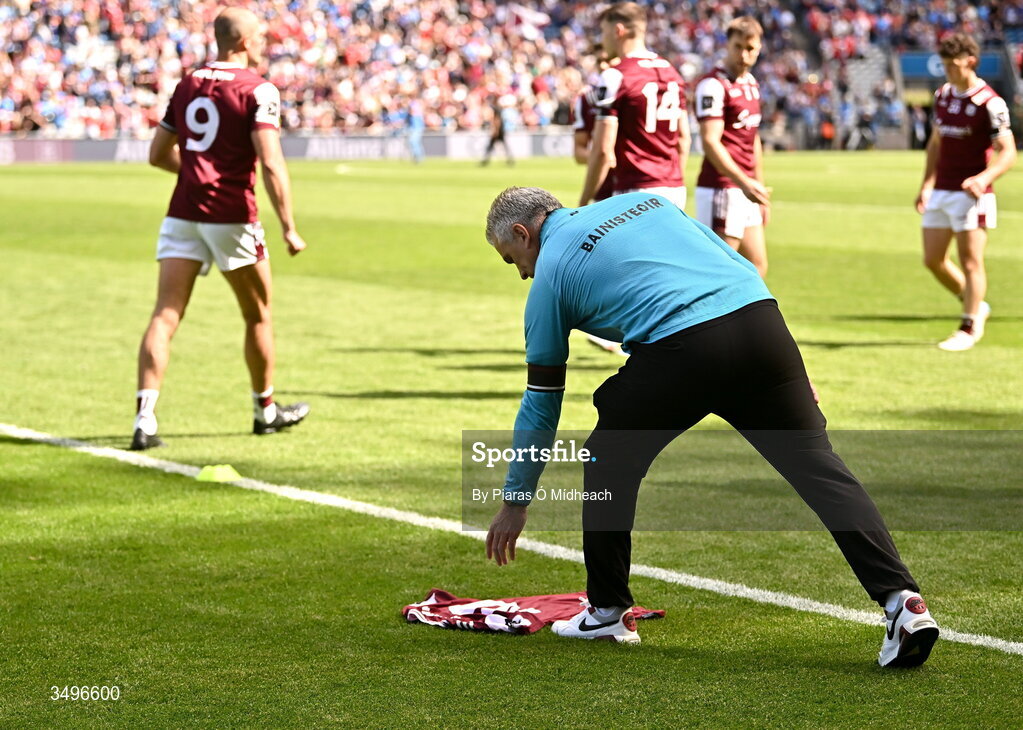 28 June 2026; Galway manager Pádraic Joyce removes the Galway number 10 from the pitch, after it was placed there during the pre-match minute's silence in memory of former Galway footballer Paul Clancy, who passed away recently, before the GAA Football All-Ireland Senior Championship quarter-final match between Dublin and Galway at Croke Park in Dublin. Photo by Piaras Ó Mídheach/Sportsfile