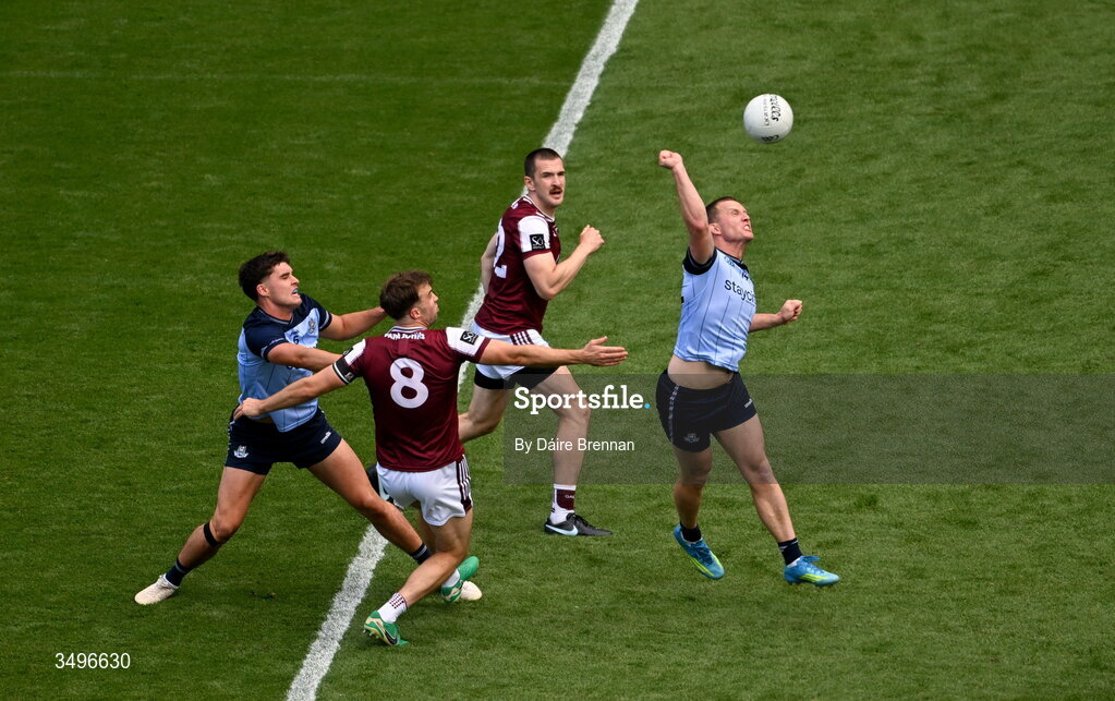 28 June 2026; Theo Clancy, left, and Ciaran Kilkenny of Dublin in action against Paul Conroy, left, and Cein Darcy of Galway during the GAA Football All-Ireland Senior Championship quarter-final match between Dublin and Galway at Croke Park in Dublin. Photo by Daire Brennan/Sportsfile