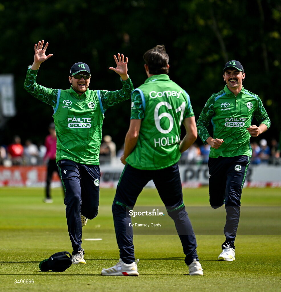 28 June 2026; Matthew Hollard of Ireland, centre, celebrates the wicket of Abhishek Sharma of India during match two of the Spinny Cup Men's T20 International series between Ireland and India at Stormont in Belfast. Photo by Ramsey Cardy/Sportsfile