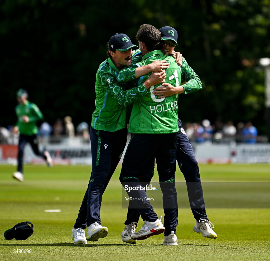 28 June 2026; Matthew Hollard of Ireland, centre, celebrates the wicket of Abhishek Sharma of India during match two of the Spinny Cup Men's T20 International series between Ireland and India at Stormont in Belfast. Photo by Ramsey Cardy/Sportsfile