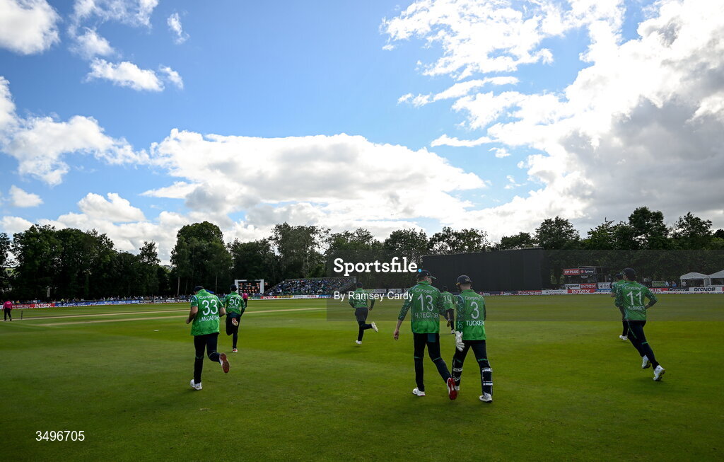 28 June 2026; The Ireland team make their way out after a rain delay in match two of the Spinny Cup Men's T20 International series between Ireland and India at Stormont in Belfast.  Photo by Ramsey Cardy/Sportsfile