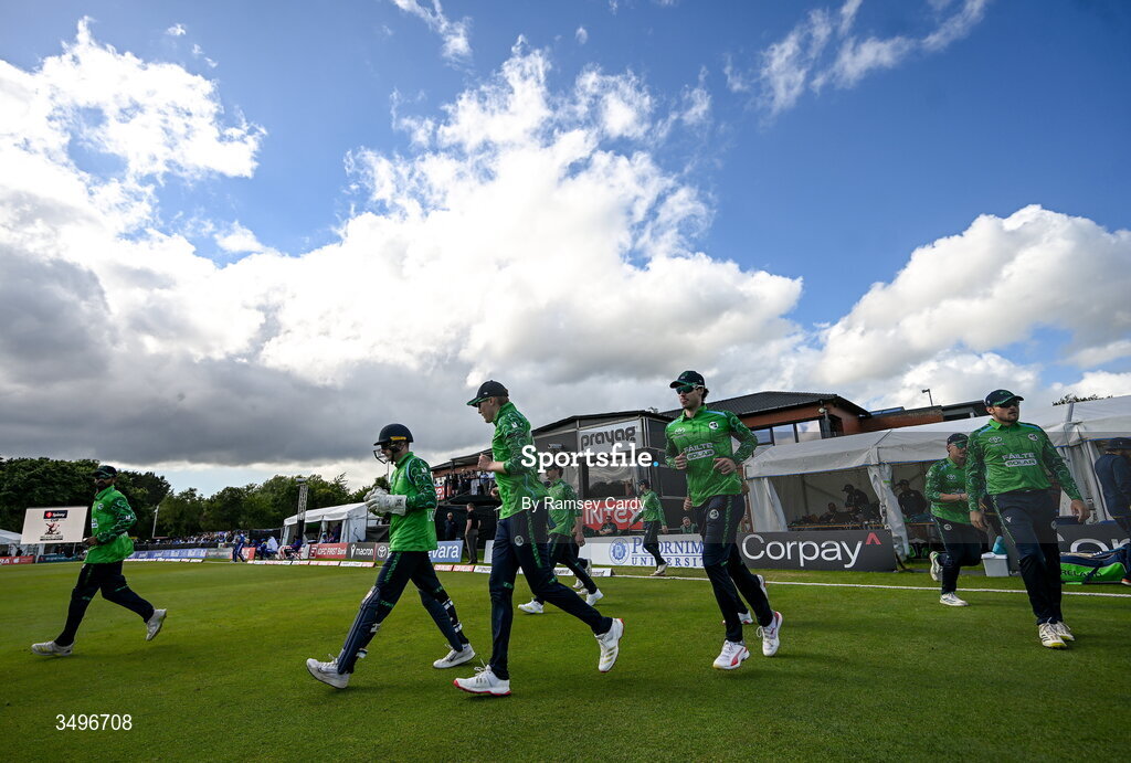 28 June 2026; The Ireland team make their way out after a rain delay in match two of the Spinny Cup Men's T20 International series between Ireland and India at Stormont in Belfast.  Photo by Ramsey Cardy/Sportsfile