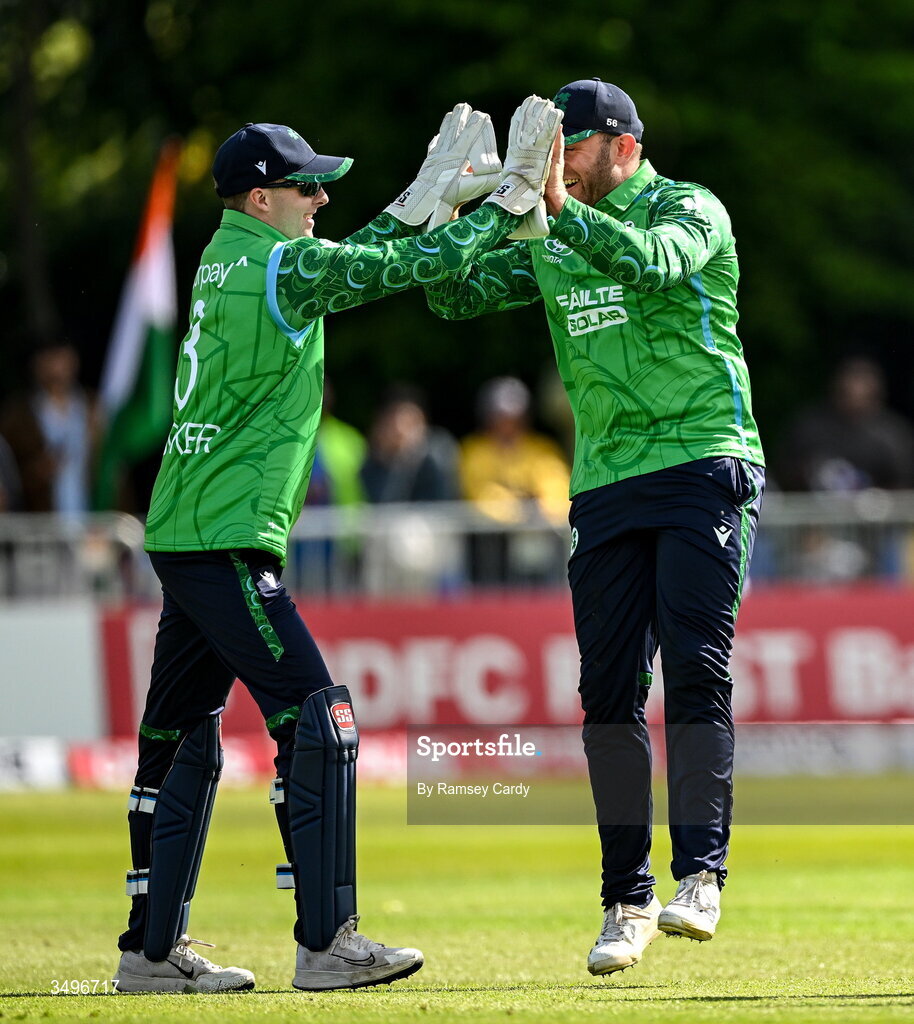 28 June 2026; Ireland wicketkeeper Lorcan Tucker celebrates taking the wicket of India batter Axar Patel with teammate Ross Adair during match two of the Spinny Cup Men's T20 International series between Ireland and India at Stormont in Belfast.  Photo by Ramsey Cardy/Sportsfile