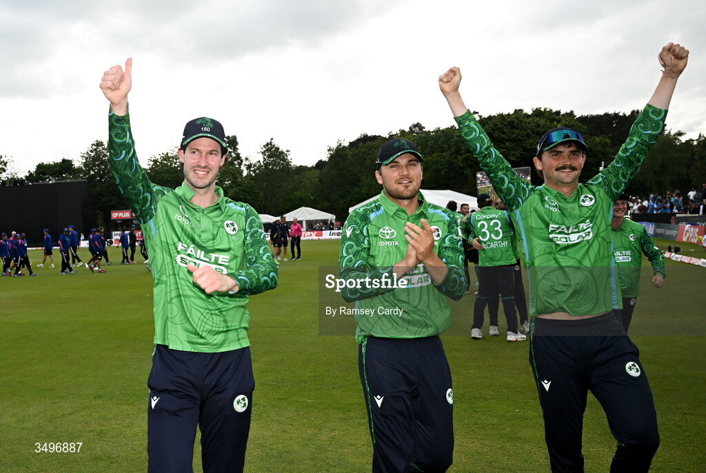 28 June 2026; Ireland players, from left, George Dockrell, Tim Tector and Matthew Humphreys celebrate after match two of the Spinny Cup Men's T20 International series between Ireland and India at Stormont in Belfast. Photo by Ramsey Cardy/Sportsfile