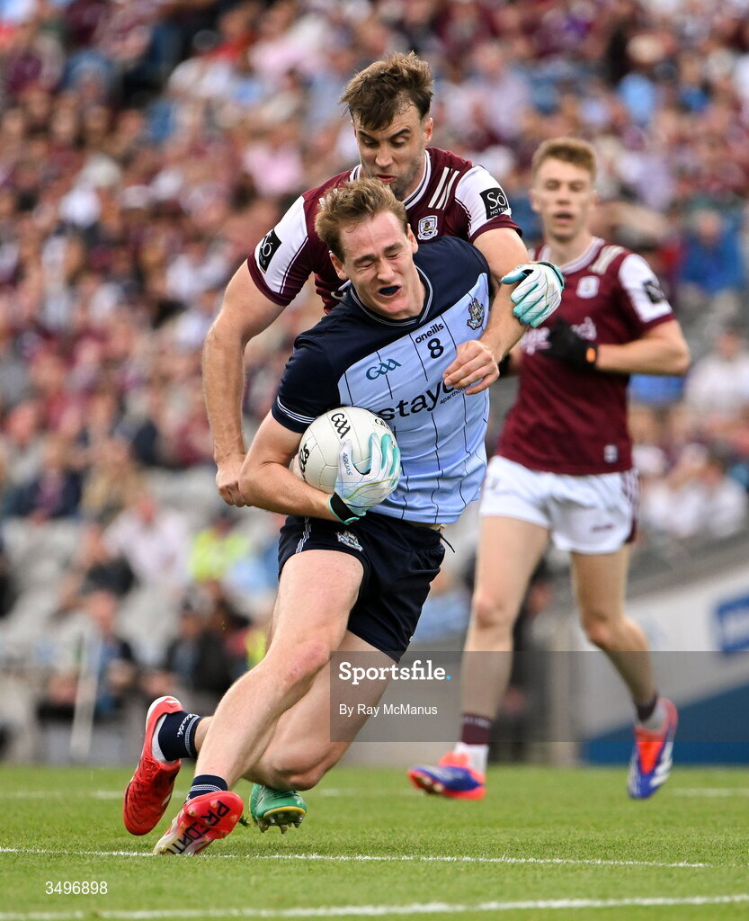 28 June 2026; Peadar Ó Cofaigh Byrne of Dublin is tackled by Paul Conroy of Galway during the GAA Football All-Ireland Senior Championship quarter-final match between Dublin and Galway at Croke Park in Dublin. Photo by Ray McManus/Sportsfile