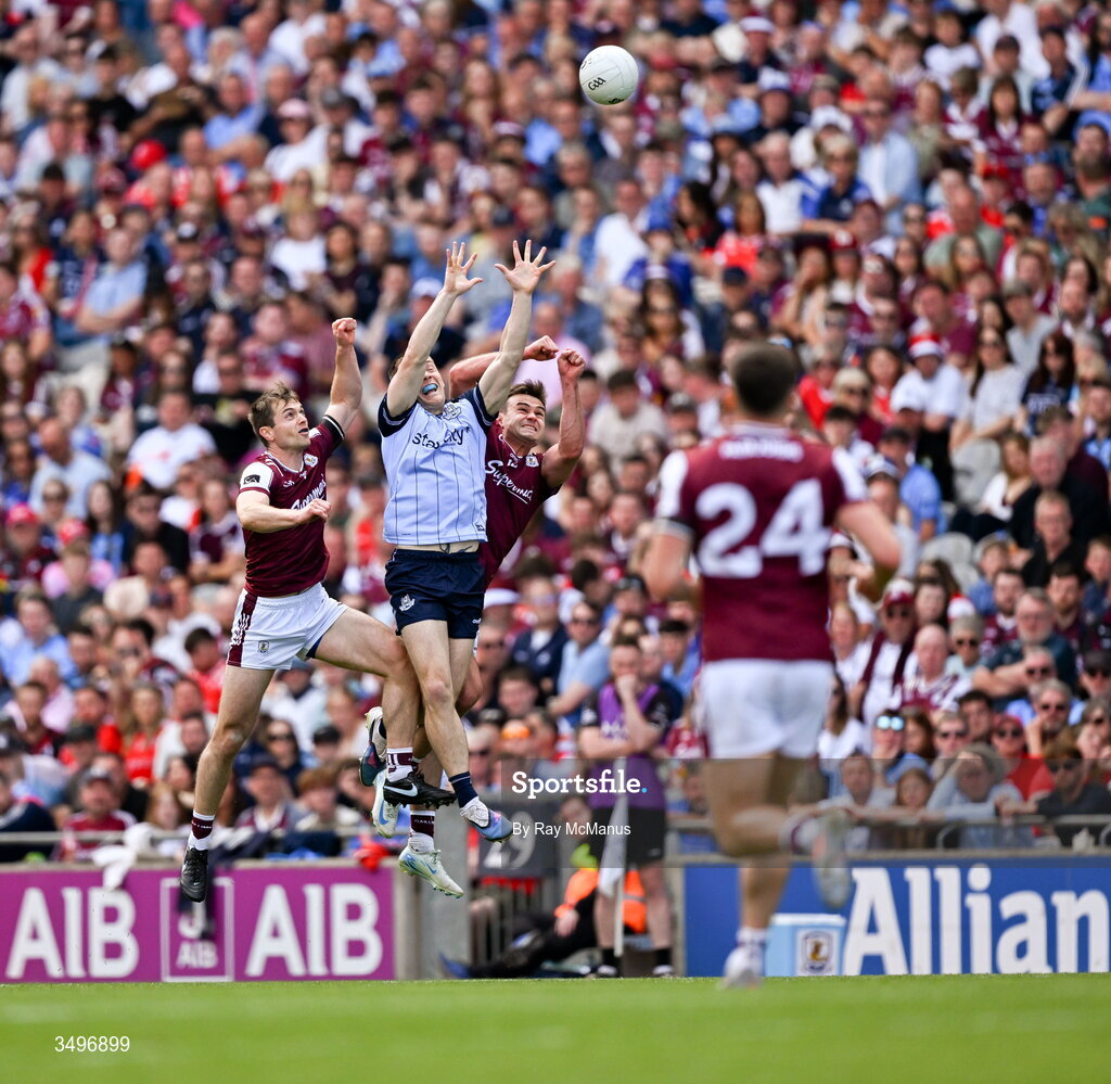 28 June 2026; Con O'Callaghan of Dublin jumps with Liam Silke and Cillian McDaid of Galway during the GAA Football All-Ireland Senior Championship quarter-final match between Dublin and Galway at Croke Park in Dublin. Photo by Ray McManus/Sportsfile