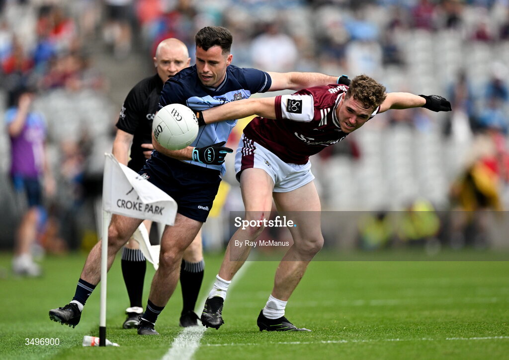 28 June 2026; Ross McGarry of Dublin is tackled by Jack Glynn of Galway during the GAA Football All-Ireland Senior Championship quarter-final match between Dublin and Galway at Croke Park in Dublin. Photo by Ray McManus/Sportsfile