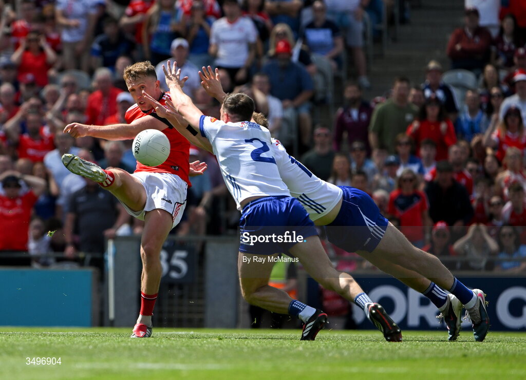 28 June 2026; Ryan Burns of Louth in action against Ryan Wylie and Aaron Carey of Monaghan during the GAA Football All-Ireland Senior Championship quarter-final match between Louth and Monaghan at Croke Park in Dublin. Photo by Ray McManus/Sportsfile