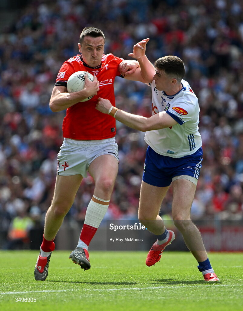 28 June 2026; Tommy Durnin of Louth is tackled by Mícheál McCarville of Monaghan during the GAA Football All-Ireland Senior Championship quarter-final match between Louth and Monaghan at Croke Park in Dublin. Photo by Ray McManus/Sportsfile