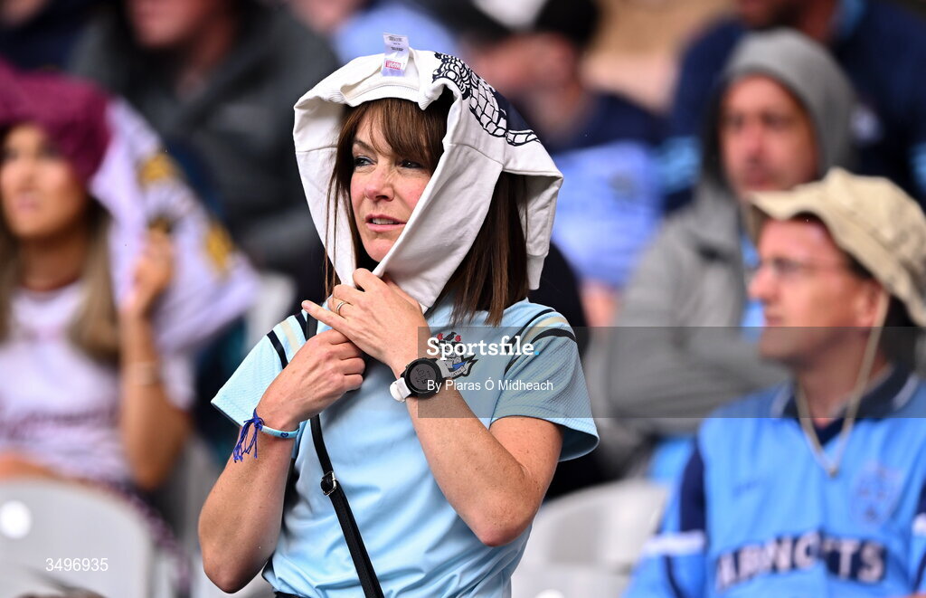 28 June 2026; A Dublin supporter during a rain shower in the GAA Football All-Ireland Senior Championship quarter-final match between Dublin and Galway at Croke Park in Dublin. Photo by Piaras Ó Mídheach/Sportsfile