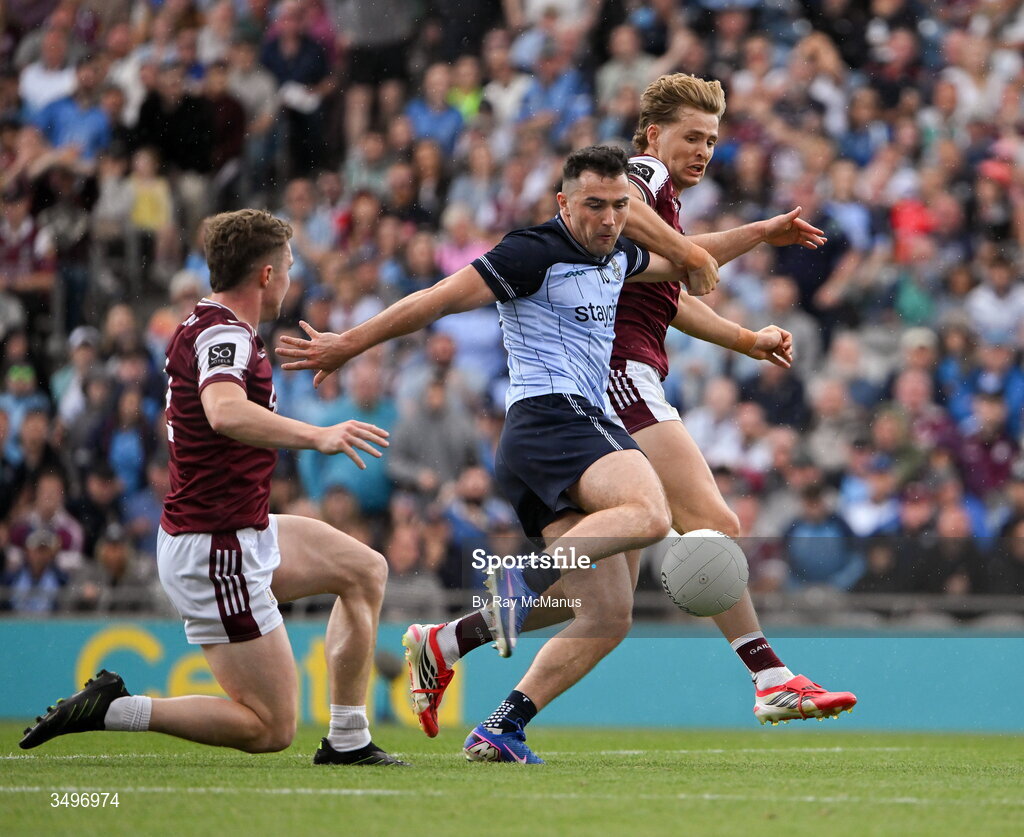 28 June 2026; Colm Basquel of Dublin has a shot on goal despite the attention of Galway players Jack Glynn, left, and Cian Hernon during the GAA Football All-Ireland Senior Championship quarter-final match between Dublin and Galway at Croke Park in Dublin. Photo by Ray McManus/Sportsfile