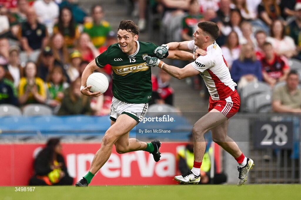 27 June 2026; David Clifford of Kerry and Niall Devlin of Tyrone during the GAA Football All-Ireland Senior Championship quarter-final match between Kerry and Tyrone at Croke Park in Dublin. Photo by Ben McShane/Sportsfile