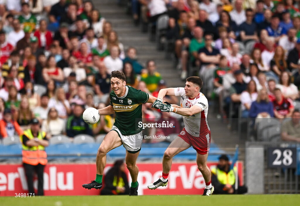27 June 2026; David Clifford of Kerry and Niall Devlin of Tyrone during the GAA Football All-Ireland Senior Championship quarter-final match between Kerry and Tyrone at Croke Park in Dublin. Photo by Ben McShane/Sportsfile