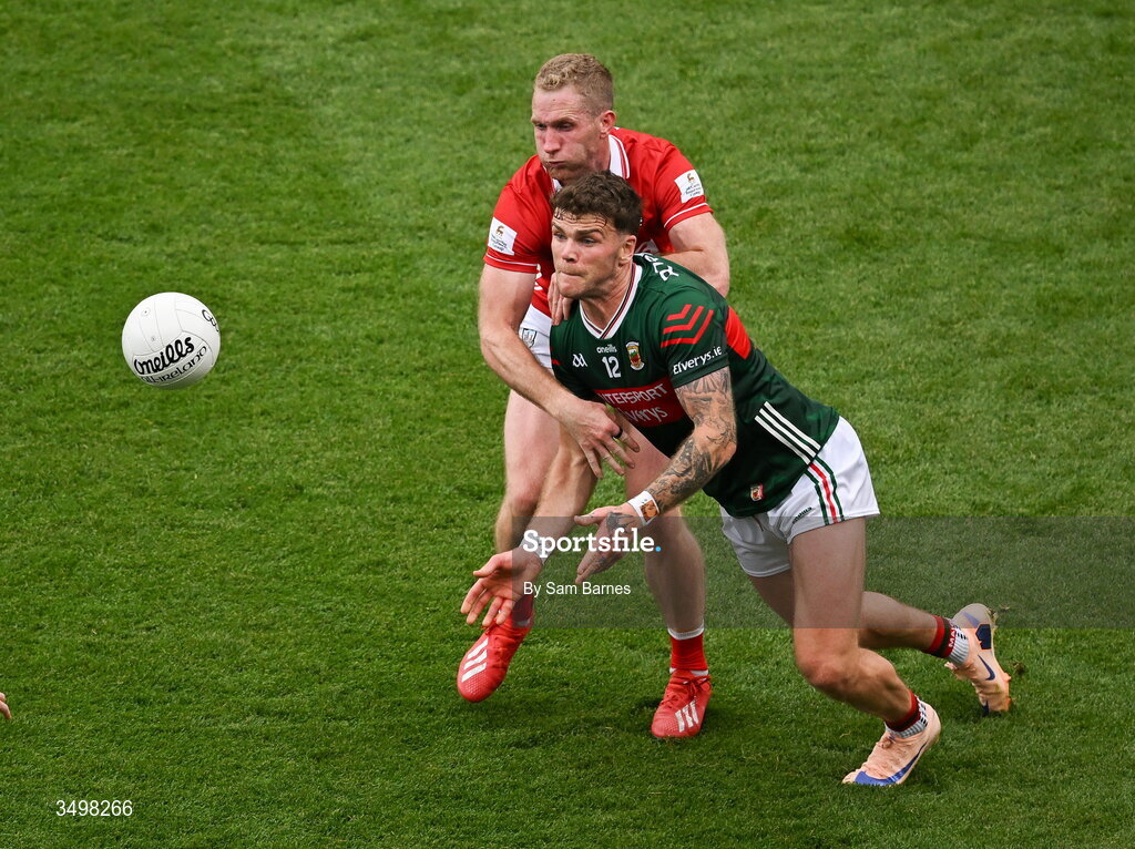 27 June 2026; Jordan Flynn of Mayo in action against Ruairi Deane of Cork during the GAA Football All-Ireland Senior Championship quarter-final match between Cork and Mayo at Croke Park in Dublin. Photo by Sam Barnes/Sportsfile