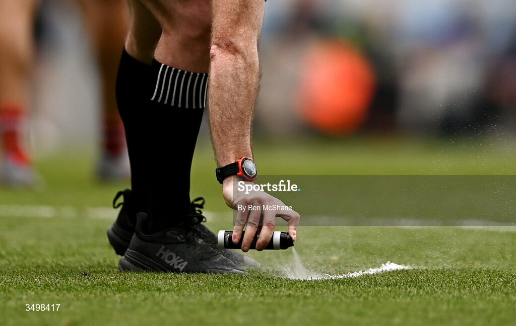 27 June 2026; Referee Martin McNally sprays marking foam during the GAA Football All-Ireland Senior Championship quarter-final match between Cork and Mayo at Croke Park in Dublin. Photo by Ben McShane/Sportsfile