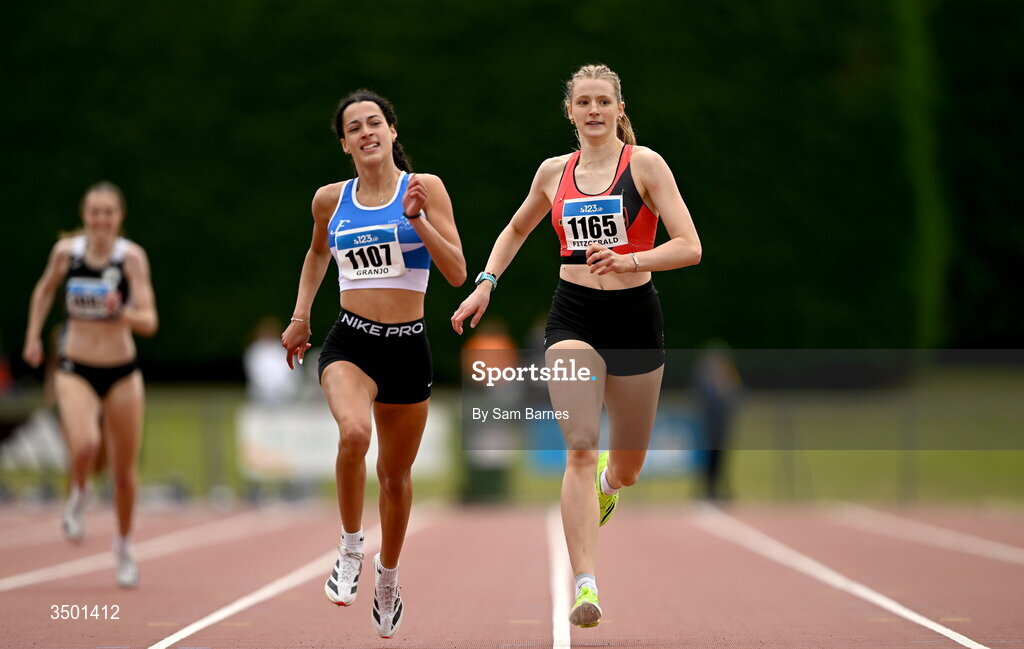 4 July 2026; Saoirse Fitzgerald of Lucan Harriers AC, Dublin, right, and Sofia Granjo of St Laurence O'Toole AC, Carlow, compete in the under 20 women's 400m heats during day one of the 123.ie National U20 & U23 Track & Field Championships at Tullamore Harriers Athletics Club in Tullamore, Offaly. Photo by Sam Barnes/Sportsfile