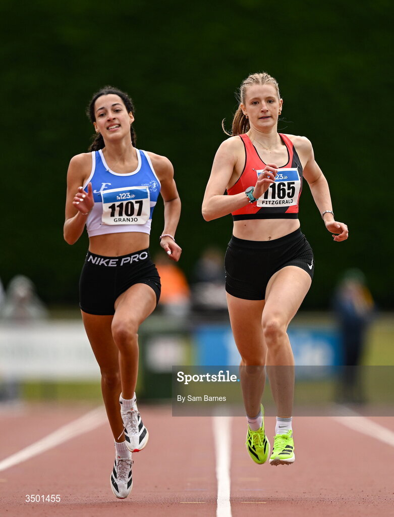 4 July 2026; Saoirse Fitzgerald of Lucan Harriers AC, Dublin, right, and Sofia Granjo of St Laurence O'Toole AC, Carlow, compete in the under 20 women's 400m heats during day one of the 123.ie National U20 & U23 Track & Field Championships at Tullamore Harriers Athletics Club in Tullamore, Offaly. Photo by Sam Barnes/Sportsfile