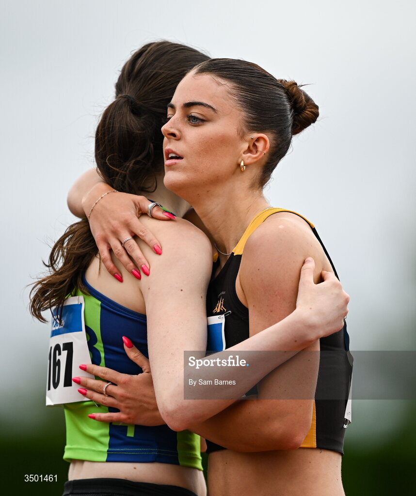 4 July 2026; Erin Friel of Letterkenny AC, Donegal, right, embraces Mia Brett of Metro/St Brigids AC, Dublin, after their under 20 women's 400m heat during day one of the 123.ie National U20 & U23 Track & Field Championships at Tullamore Harriers Athletics Club in Tullamore, Offaly. Photo by Sam Barnes/Sportsfile