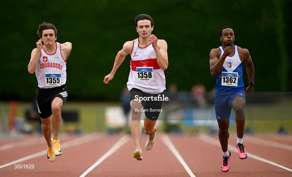 4 July 2026; Lucas Fadden of Galway City Harriers, AC, Galway, centre, on his way winning the under 23 men's 100m final, ahead of Luke Timlin of Crusaders AC, Dublin, left, and Osamudiamen Jesse Osas of Ratoath AC, Meath, right, during day one of the 123.ie National U20 & U23 Track & Field Championships at Tullamore Harriers Athletics Club in Tullamore, Offaly. Photo by Sam Barnes/Sportsfile