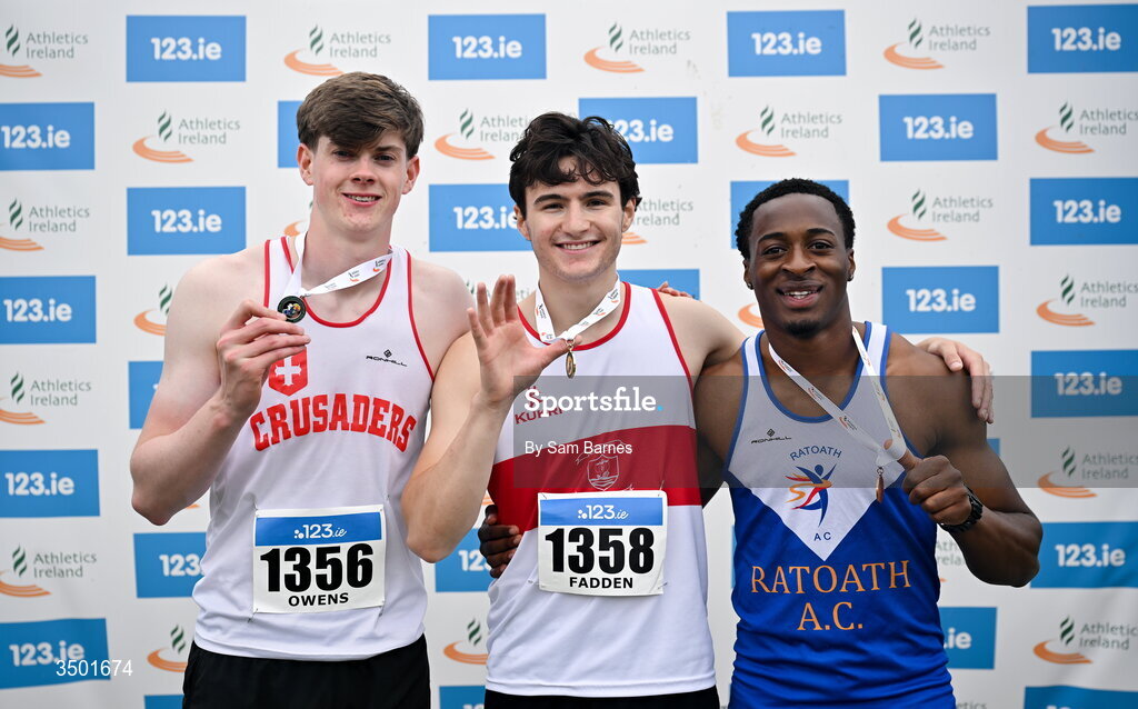 4 July 2026; Under 23 men's 100m medallists, Lucas Fadden of Galway City Harriers AC, Galway, centre, gold, Sean Owens of Crusaders AC, Dublin, left, silver, and Osamudiamen Jesse Osas of Ratoath AC, Meath, right, bronze, during day one of the 123.ie National U20 & U23 Track & Field Championships at Tullamore Harriers Athletics Club in Tullamore, Offaly. Photo by Sam Barnes/Sportsfile