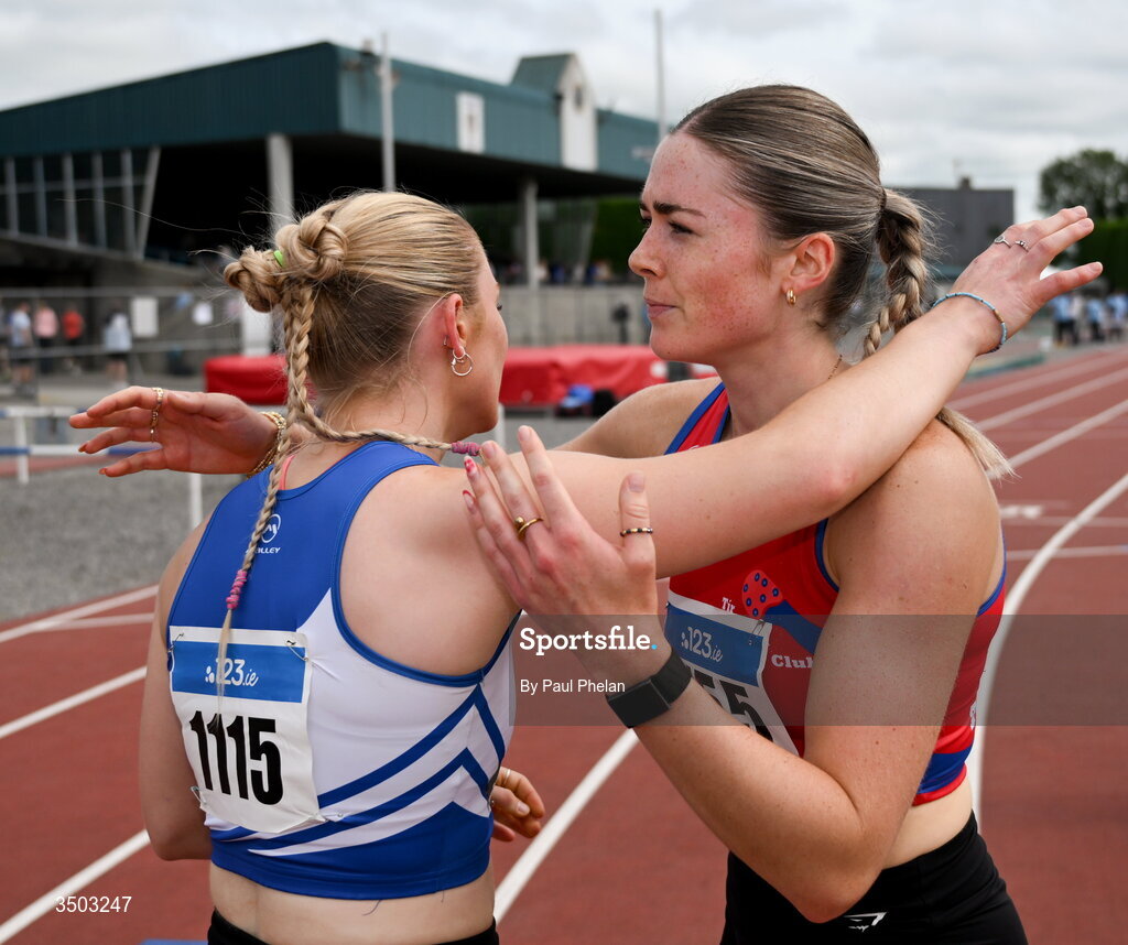 5 July 2026; Jennifer Sawyer of St. Laurence. O'Toole A.C., who fininshed first, embraces Lucy Mc Glynn of Tír Chonaill A.C., who fininshed second, after the U23 women's 400m Hurdles during day two of the 123.ie National U20 & U23 Track & Field Championships at Tullamore Harriers Athletics Club in Tullamore, Offaly. Photo by Paul Phelan/Sportsfile