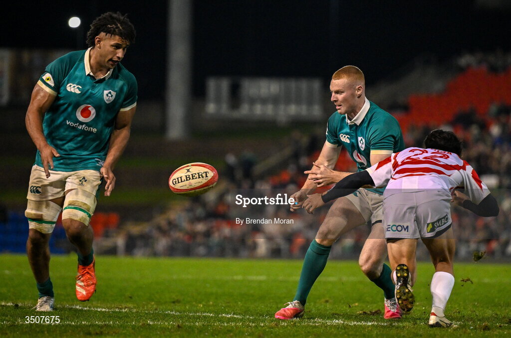 11 July 2026; Nathan Doak of Ireland offloads to teammate Cormac Izuchukwu during the 2026 Nations Championship Round Two match between Japan and Ireland at McDonald Jones Stadium in Newcastle, Australia. Photo by Brendan Moran/Sportsfile
