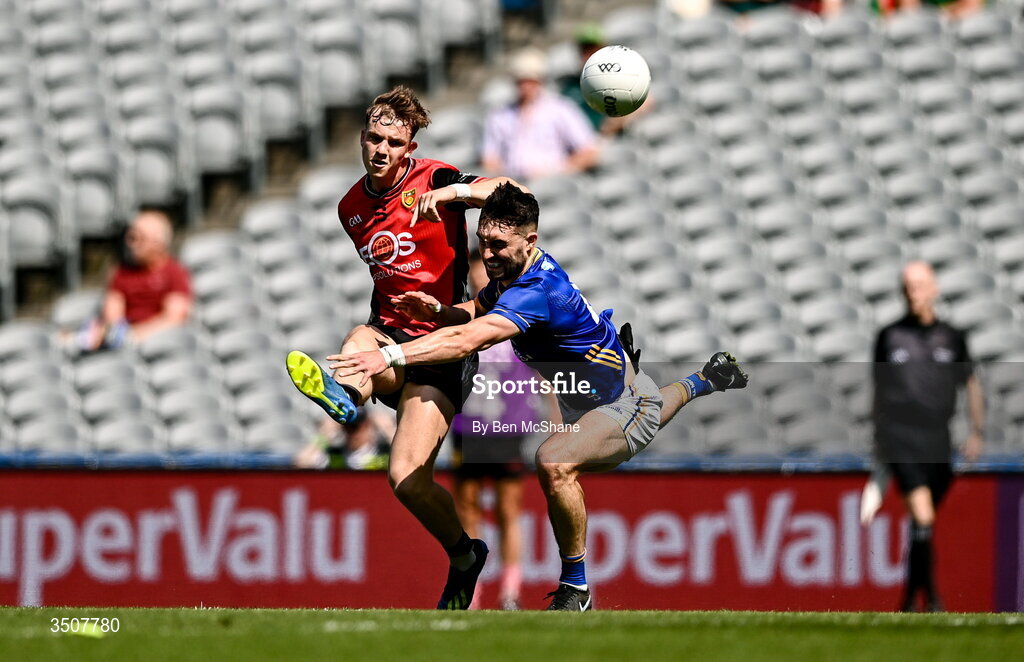 11 July 2026; Eamon Brown of Down kicks a point despite the tackle of Malachy Stone of Wicklow during the Tailteann Cup final match between Down and Wicklow at Croke Park in Dublin. Photo by Ben McShane/Sportsfile