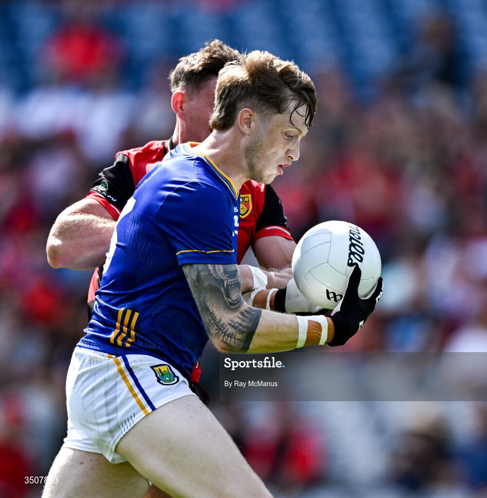 11 July 2026; Oisín McGraynor of Wicklow is tackled by Ryan McEvoy of Down during the Tailteann Cup final match between Down and Wicklow at Croke Park in Dublin. Photo by Ray McManus/Sportsfile