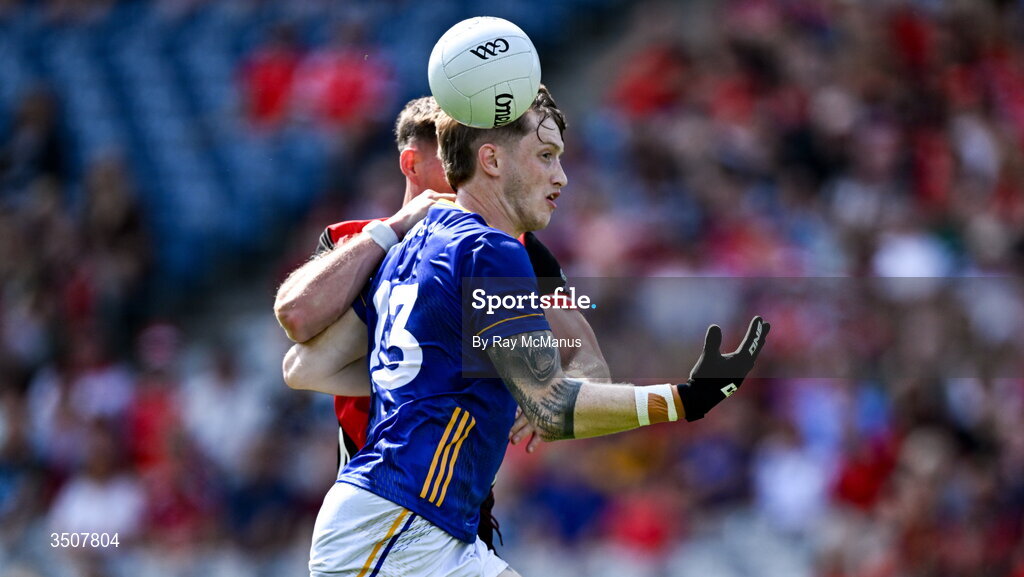 11 July 2026; Oisín McGraynor of Wicklow is tackled by Ryan McEvoy of Down during the Tailteann Cup final match between Down and Wicklow at Croke Park in Dublin. Photo by Ray McManus/Sportsfile