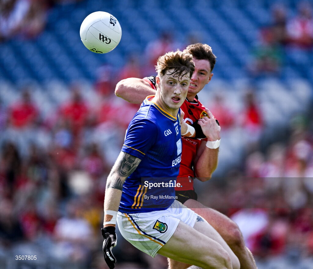 11 July 2026; Oisín McGraynor of Wicklow is tackled by Ryan McEvoy of Down during the Tailteann Cup final match between Down and Wicklow at Croke Park in Dublin. Photo by Ray McManus/Sportsfile